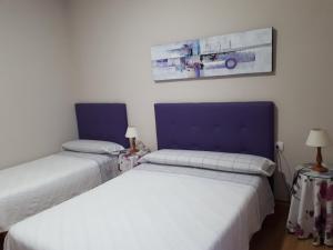 Posteľ alebo postele v izbe v ubytovaní Pension Loinaz