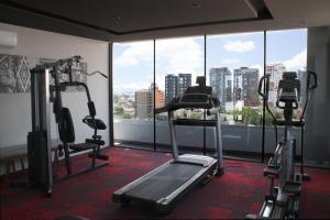 a gym with a view of a city at Hotel Love It Consulado in Guadalajara