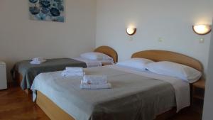 Postel nebo postele na pokoji v ubytování Guest House Mamut