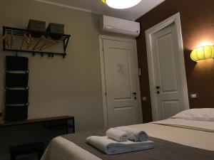 Ein Bett oder Betten in einem Zimmer der Unterkunft Residenza Roma Imperiale