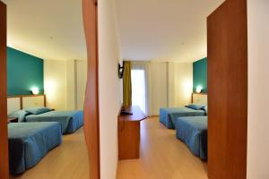 Postel nebo postele na pokoji v ubytování Hotel La Pieve