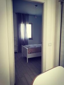 Postel nebo postele na pokoji v ubytování Brezza Del Mare