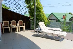 a group of chairs sitting on a patio at Sovinyon in Odesa