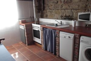 A kitchen or kitchenette at Casa Gorio