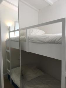 a room with two bunk beds and a mirror at Saint-Tropez walking distance, sea view house in Saint-Tropez +23 photos