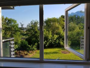 a window with a view of a yard at Dublin Airport Room in Dublin