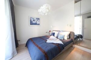 Posteľ alebo postele v izbe v ubytovaní ASKI New Powiśle Copernicus Apartment