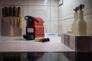 a coffee maker sitting on top of a counter at Sweet home with spectacular sea view in Paleo Tsifliki +37 photos