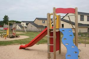 a playground with a slide in a park at Zee en polder nummer 16 in Middelkerke
