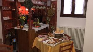 a table with a table with food on it at Cascina Cologna in Galbiate