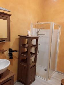 a bathroom with a shower and a sink at La Parenthèse in Saint-Genix-sur-Guiers