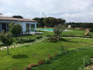 Сад в 309 Le Saline - Stintino
