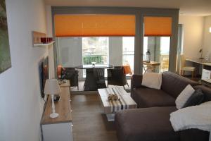 a living room with a couch and a table at Stadtwohnung Hans in Füssen