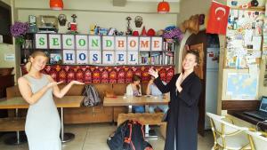 two women standing in front of a store at Second Home Hostel in Istanbul