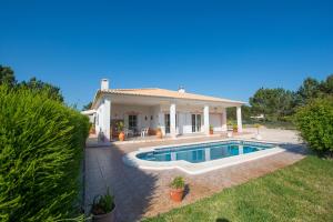 a house with a swimming pool in the yard at Casa Naboo - Sunny Holiday Home with Pool in Aljezur
