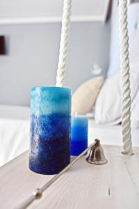 a blue candle sitting on top of a table at Alkyoni City Apartment in Rhodes Town