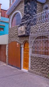a brick building with a large window at Bed & Breakfast Cleofe Arequipa in Arequipa