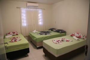 Casa de Temporada na Orla tesisinde bir odada yatak veya yataklar