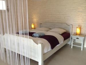 Postel nebo postele na pokoji v ubytování bnb Valais - by La Sittelle