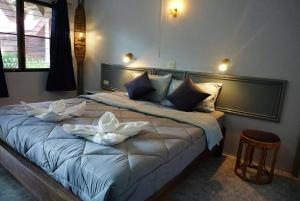 מיטה או מיטות בחדר ב-Diamond Sand Palace - SHA Plus