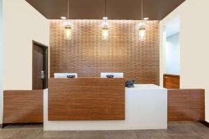 a lobby with a counter with two sinks at Wingate by Wyndham Page Lake Powell in Page