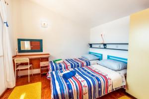 Un pat sau paturi într-o cameră la Holiday Home Gluscevic