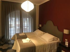 Ein Bett oder Betten in einem Zimmer der Unterkunft Residenza Roma Imperiale