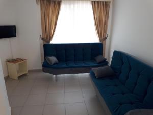 A seating area at Paradise Apart Hotel