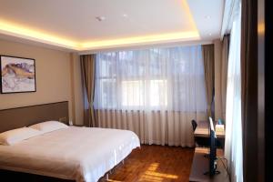 Voodi või voodid majutusasutuse Hangzhou Yuqi Hotel toas