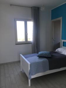 Postel nebo postele na pokoji v ubytování Brezza Del Mare