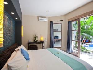 Cama o camas de una habitación en Enigma Bali Villas