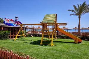 a playground with a chair and a slide at Jaz Dahabeya in Dahab