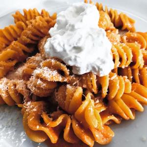 a plate of waffle fries with sour cream at Hotel La Rosetta Scauri in Scauri