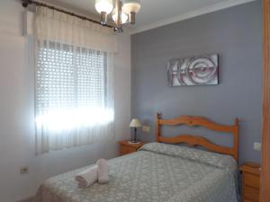 Posteľ alebo postele v izbe v ubytovaní Apartamento primera linea de playa WIFI gratis