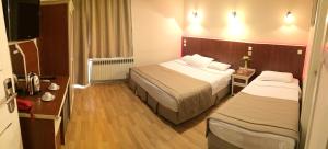 Postel nebo postele na pokoji v ubytování Ayvazali Hotel