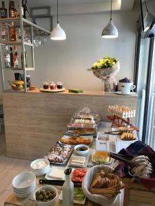 a buffet with many different types of food on a table at Mirabilia Boutique Hotel in Kriopigi