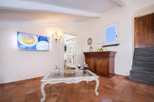 TV o dispositivi per l'intrattenimento presso Villa Alba d'Oro - Historic luxury villa
