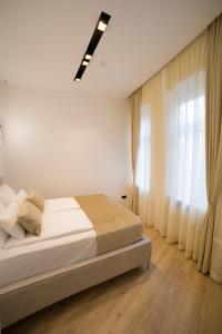 Cama ou camas em um quarto em Premium Apartments
