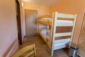 Postel nebo postele na pokoji v ubytování Penzion Šatovské lípy