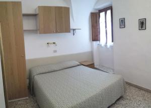 Postel nebo postele na pokoji v ubytování Camere la torre