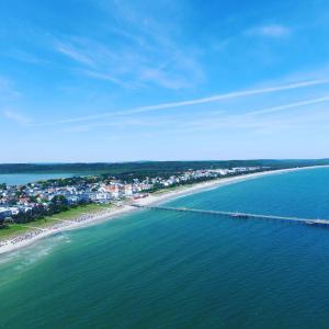 an aerial view of a beach with a pier at Ferienwohnung in Binz an der Granitz in Binz