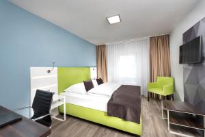 Ein Bett oder Betten in einem Zimmer der Unterkunft Best Western Hotel Mannheim City