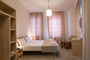 Postel nebo postele na pokoji v ubytování Hotel Opinion