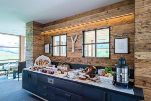 a kitchen with a counter with food on it at Miraval NaturHotel in Badia
