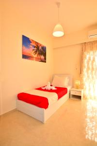 A bed or beds in a room at Luxury Suites in Stavromenos