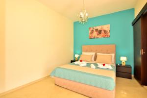 A bed or beds in a room at Luxury Suites in Stavromenos