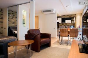 a living room with a couch and a table at Old Riga Modern Apartment in Riga
