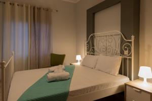 Postel nebo postele na pokoji v ubytování Electra Apartments & Studios + 48 fotografií