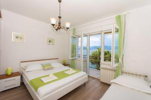 Posteľ alebo postele v izbe v ubytovaní Apartman Domić