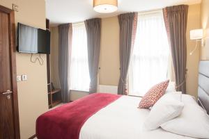 Voodi või voodid majutusasutuse The Draper Rooms toas